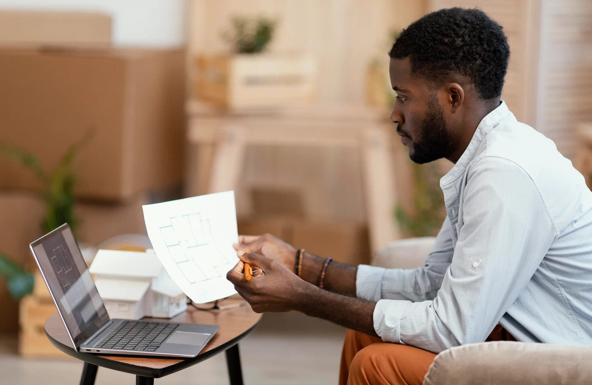 Property owner reviewing a floor plan at home