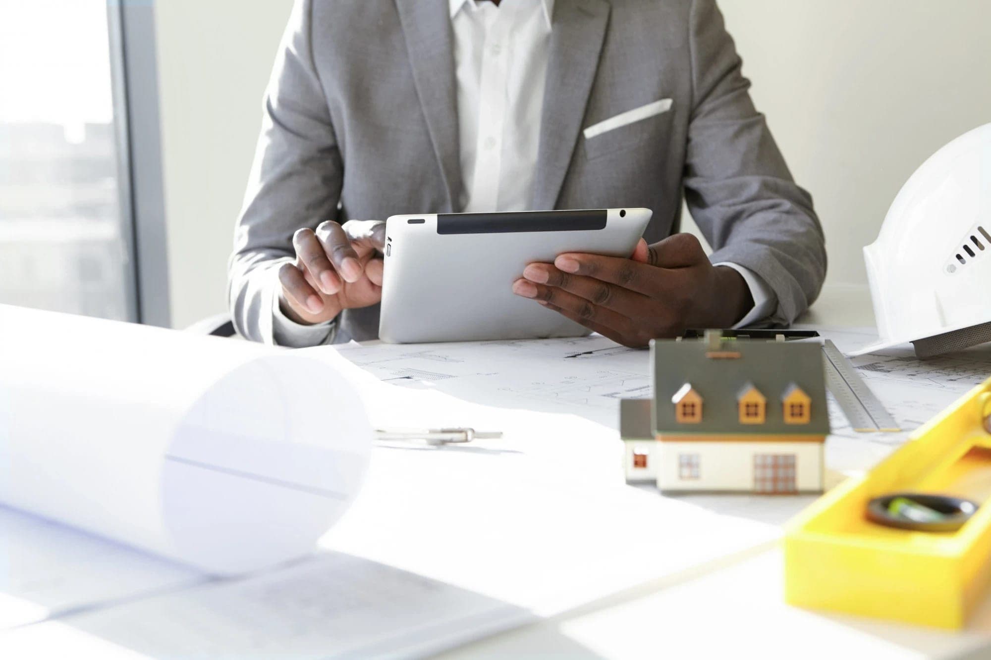 Property manager reviewing plans on a tablet